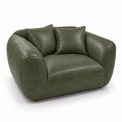 Poltrona Ventura Verde Esmeralda em Couro Naturale Premium — uma poltrona com duas almofadas